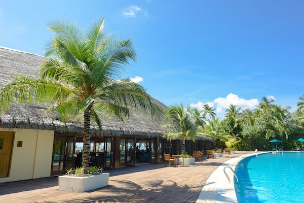 A beautiful poolside in a revenue generating resort