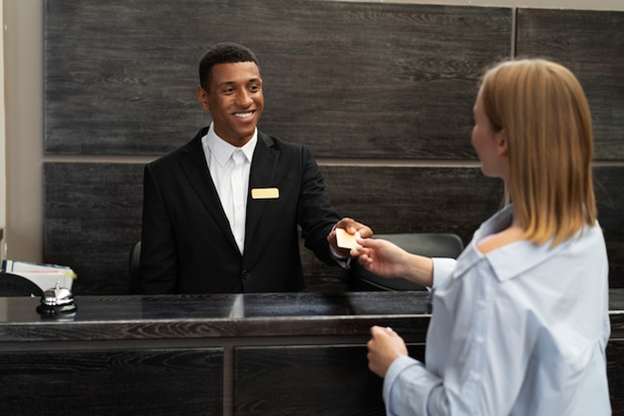 Hotel receptionist treating the hotel guest with kindness and top-tier customer service